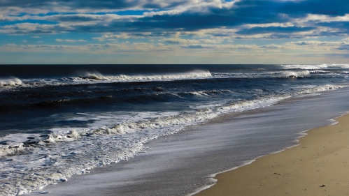 Waves rolling into the Jersey shore.