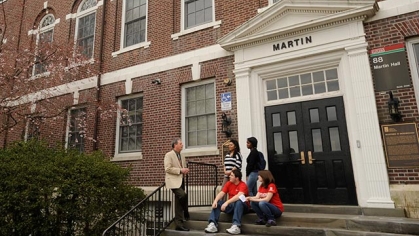 A group of people on the steps of Martin Hall.