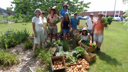 Rutgers Master Gardeners displaying produce from their garden.