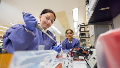 Two students in a lab.