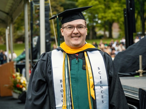 A SEBS graduate in regalia.